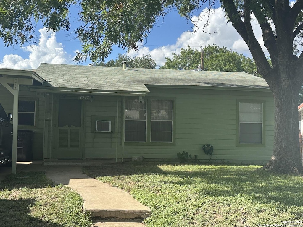 3247 Lasses, San Antonio, TX 78223 - view of front of house featuring a front lawn