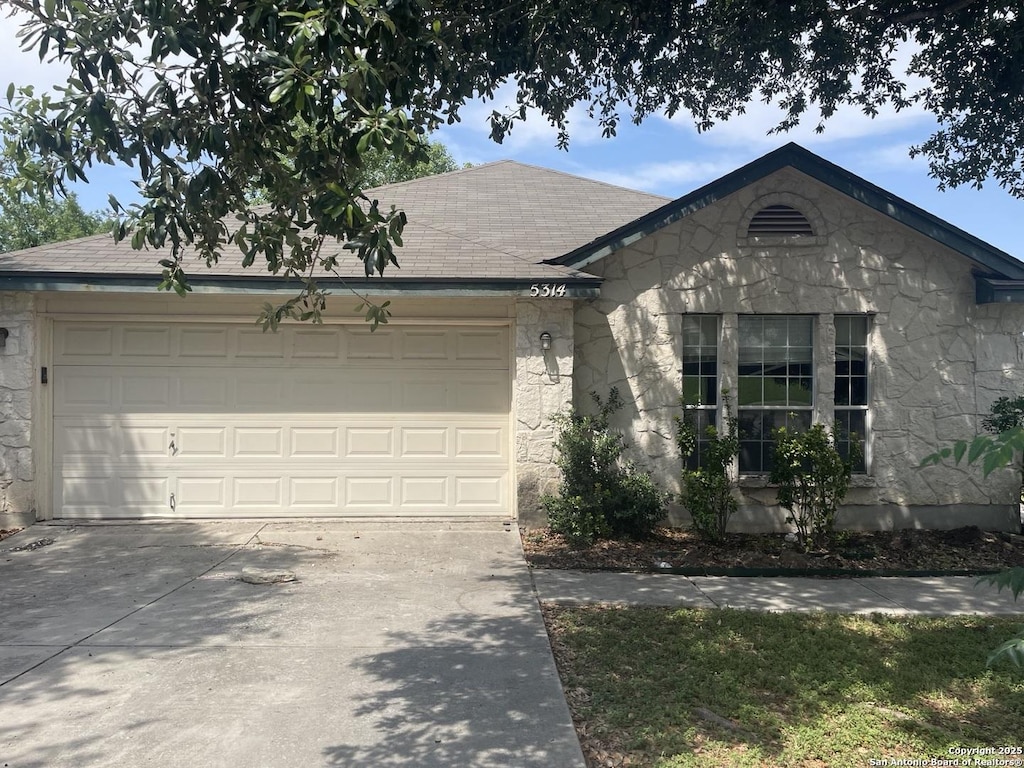 5314 Lost Tree, San Antonio, TX 78244 - ranch-style home featuring stone siding, driveway, an attached garage, and a shingled roof