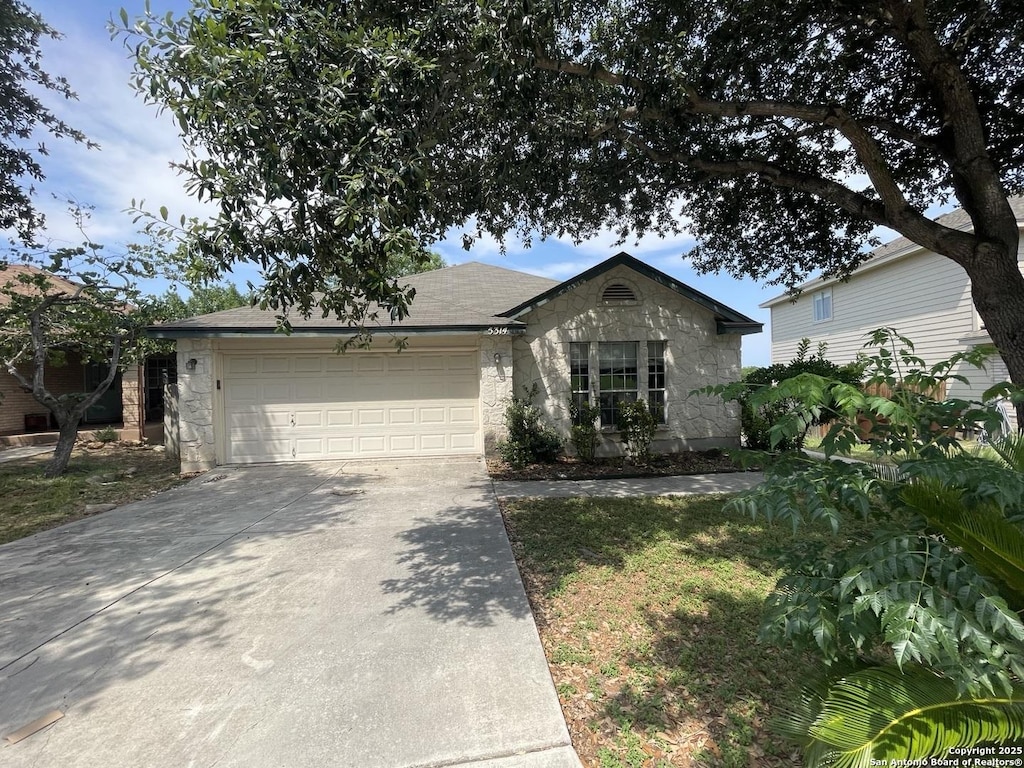 5314 Lost Tree, San Antonio, TX 78244 - single story home with a garage, driveway, and stone siding