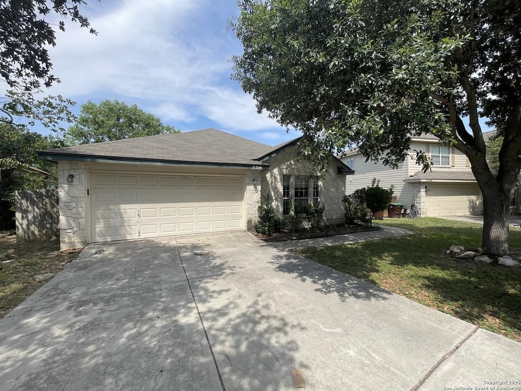 5314 Lost Tree, San Antonio, TX 78244 - ranch-style house with concrete driveway, a garage, and stone siding