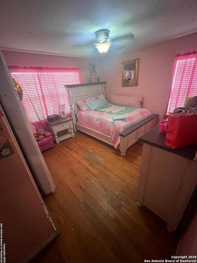 4849 Briarbend, Houston, TX 77035 - bedroom featuring wood finished floors and a ceiling fan