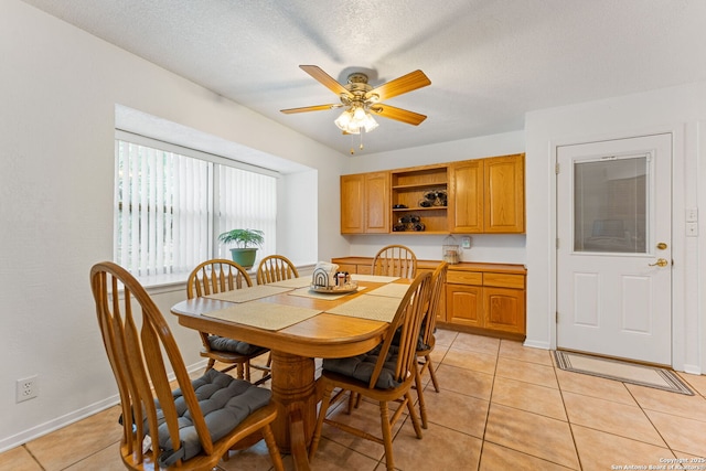 33171 Blanco Rd, Bulverde, TX 78163 - dining room with light tile patterned floors, a ceiling fan, and a textured ceiling