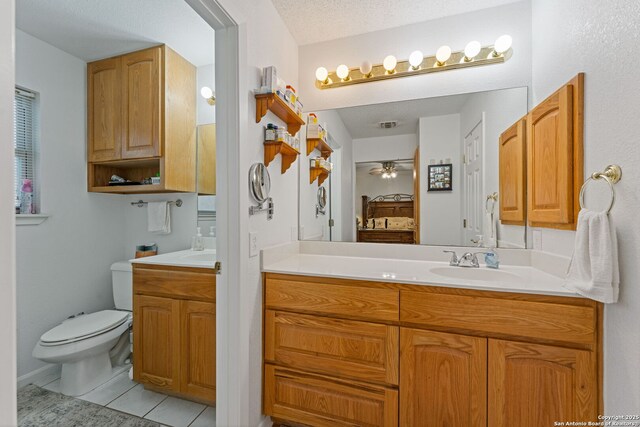 33171 Blanco Rd, Bulverde, TX 78163 - bathroom featuring vanity, a ceiling fan, connected bathroom, and tile patterned flooring