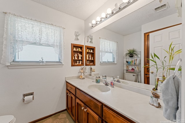 33171 Blanco Rd, Bulverde, TX 78163 - bathroom featuring vanity and a textured ceiling