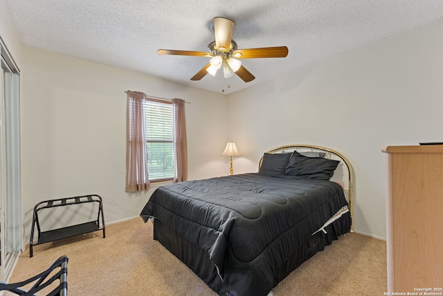 33171 Blanco Rd, Bulverde, TX 78163 - carpeted bedroom with a ceiling fan and a textured ceiling
