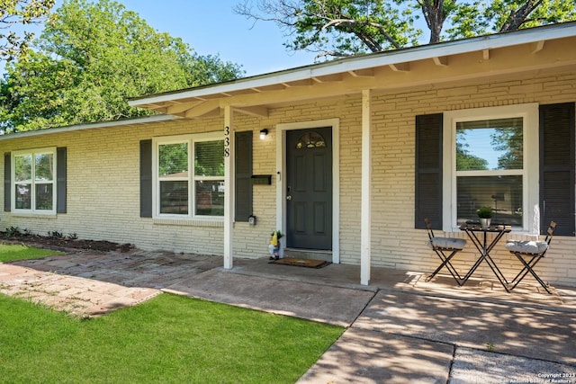 338 Tomrob Dr, San Antonio, TX 78220 - property entrance with brick siding and a porch