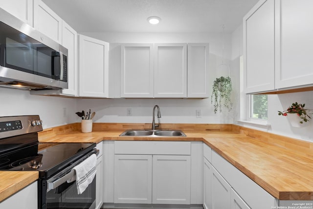 338 Tomrob Dr, San Antonio, TX 78220 - kitchen featuring wooden counters and stainless steel appliances