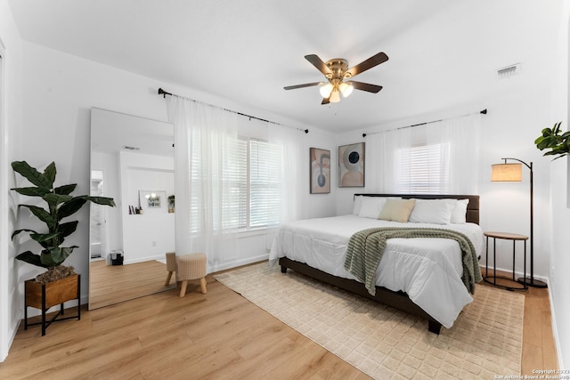 338 Tomrob Dr, San Antonio, TX 78220 - bedroom featuring multiple windows, light wood-type flooring, and a ceiling fan