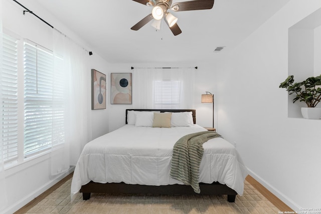 338 Tomrob Dr, San Antonio, TX 78220 - bedroom with wood finished floors and a ceiling fan