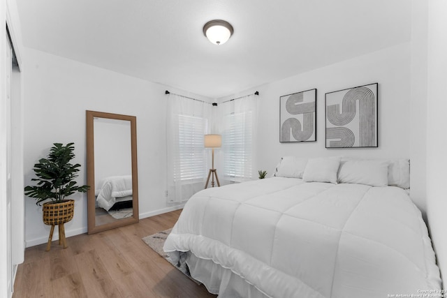 338 Tomrob Dr, San Antonio, TX 78220 - bedroom with light wood finished floors and baseboards