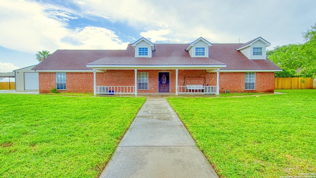 103 Weese, Pleasanton, TX 78064 - cape cod home with covered porch, brick siding, roof with shingles, and a garage