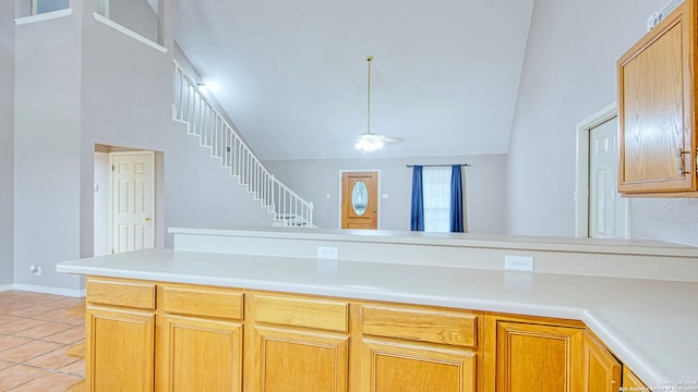 103 Weese, Pleasanton, TX 78064 - kitchen with light tile patterned floors, light countertops, and high vaulted ceiling