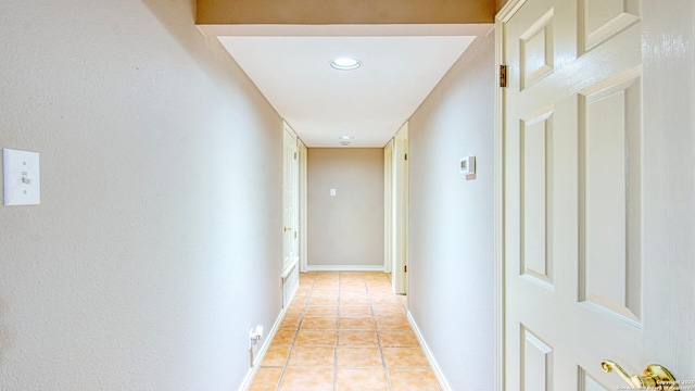 103 Weese, Pleasanton, TX 78064 - corridor with light tile patterned flooring and baseboards
