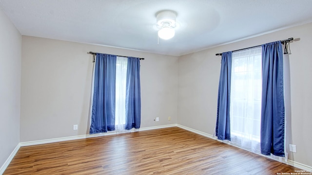 103 Weese, Pleasanton, TX 78064 - spare room featuring wood finished floors and ceiling fan
