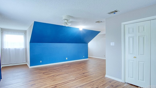 103 Weese, Pleasanton, TX 78064 - bonus room with a textured ceiling, wood finished floors, and lofted ceiling