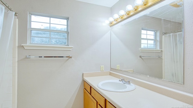103 Weese, Pleasanton, TX 78064 - bathroom with vanity and a shower with curtain