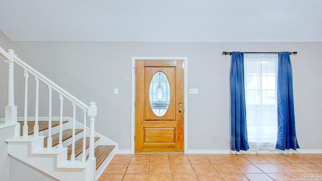 103 Weese, Pleasanton, TX 78064 - entryway featuring light tile patterned floors and stairs