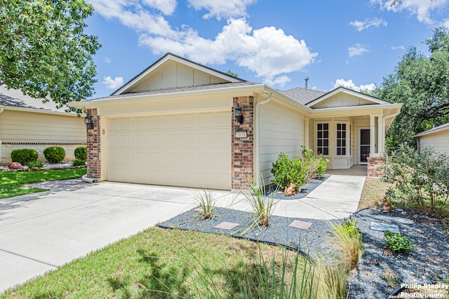 5038 Sandhill Crane, San Antonio, TX 78253 - ranch-style house featuring a garage, board and batten siding, concrete driveway, and brick siding
