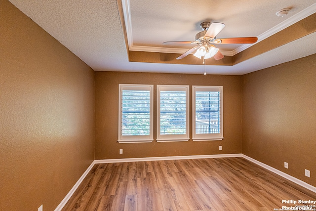 5038 Sandhill Crane, San Antonio, TX 78253 - spare room with wood finished floors, ceiling fan, a tray ceiling, crown molding, and a smoke detector