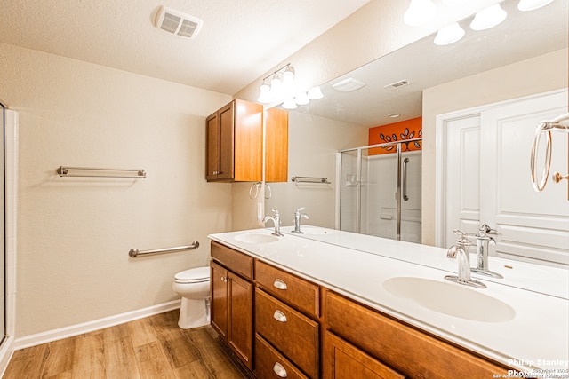 5038 Sandhill Crane, San Antonio, TX 78253 - full bath featuring wood finished floors, a stall shower, and double vanity