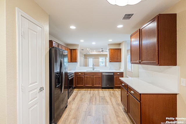 5038 Sandhill Crane, San Antonio, TX 78253 - kitchen with stainless steel appliances, light wood-type flooring, brown cabinetry, light countertops, and recessed lighting