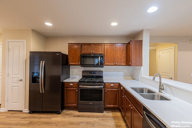 5038 Sandhill Crane, San Antonio, TX 78253 - kitchen featuring stainless steel appliances, light countertops, light wood-style floors, and recessed lighting