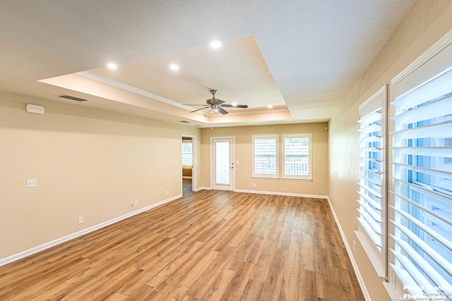 5038 Sandhill Crane, San Antonio, TX 78253 - empty room with a raised ceiling, a ceiling fan, light wood finished floors, recessed lighting, and crown molding