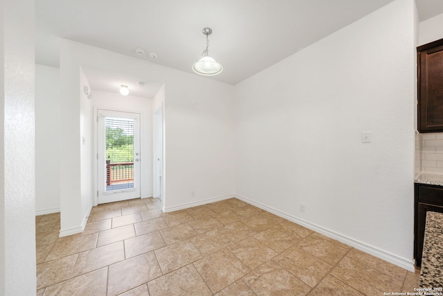 14724 Costa Leon, San Antonio, TX 78245 - unfurnished dining area featuring baseboards
