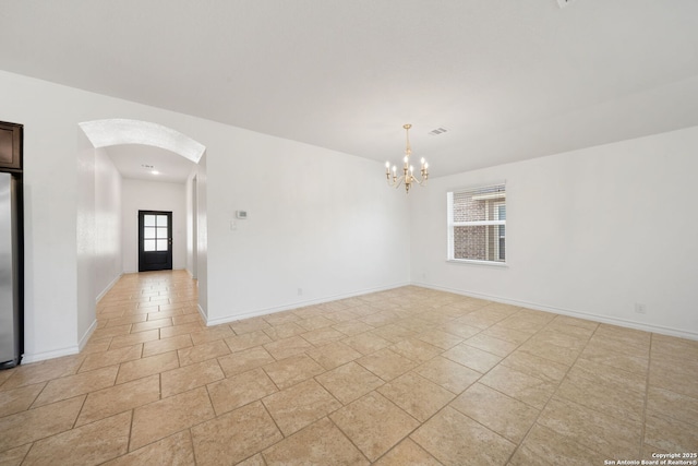 14724 Costa Leon, San Antonio, TX 78245 - spare room featuring arched walkways and a chandelier