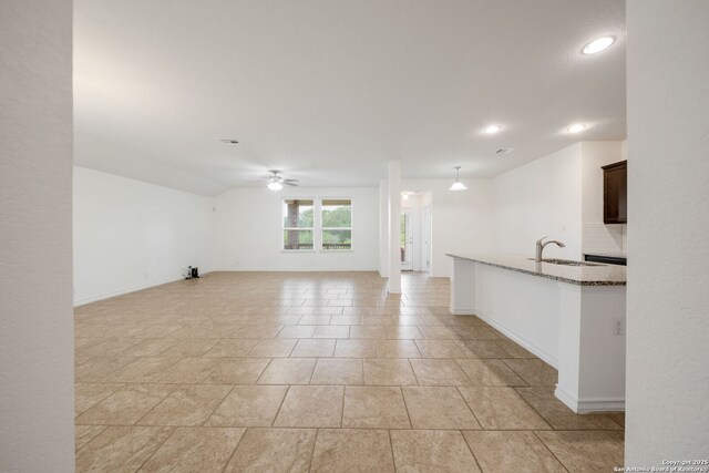14724 Costa Leon, San Antonio, TX 78245 - unfurnished living room with ceiling fan and recessed lighting