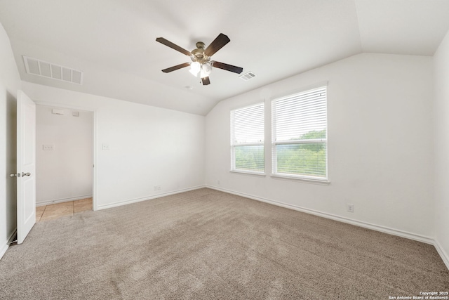 14724 Costa Leon, San Antonio, TX 78245 - spare room with lofted ceiling, ceiling fan, and light colored carpet