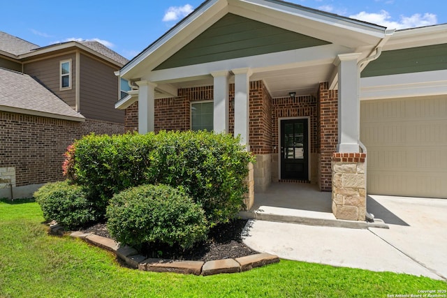 14724 Costa Leon, San Antonio, TX 78245 - view of exterior entry featuring a garage, brick siding, and driveway