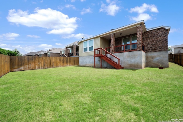 14724 Costa Leon, San Antonio, TX 78245 - rear view of house featuring a fenced backyard, stairway, and brick siding
