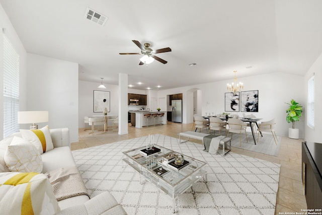 14724 Costa Leon, San Antonio, TX 78245 - living room featuring arched walkways, a chandelier, ceiling fan, and light tile patterned floors