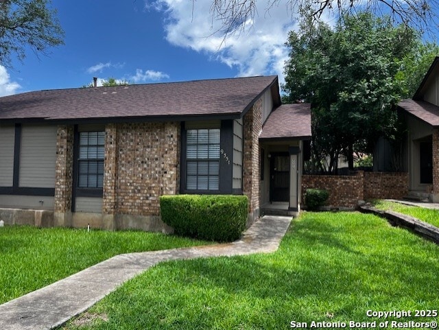 9351 Dover Rdg, San Antonio, TX 78250 - view of front of home with a front yard and brick siding