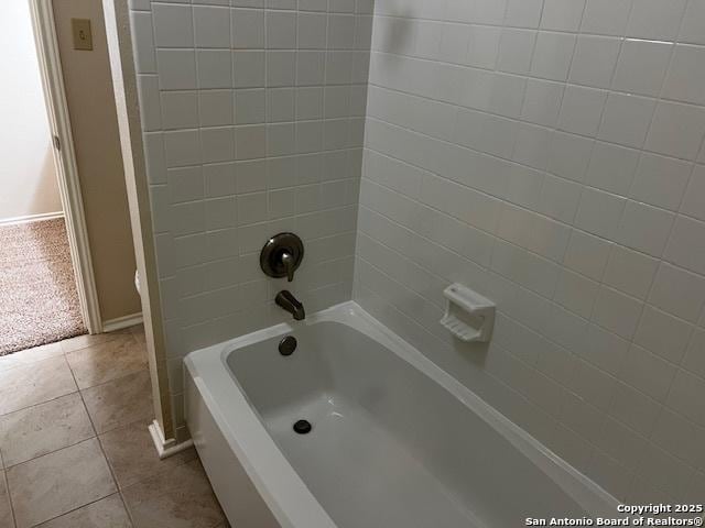 9351 Dover Rdg, San Antonio, TX 78250 - bathroom featuring tile patterned flooring and bathtub / shower combination