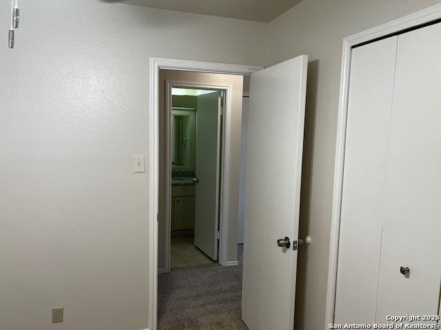 9351 Dover Rdg, San Antonio, TX 78250 - corridor with carpet floors