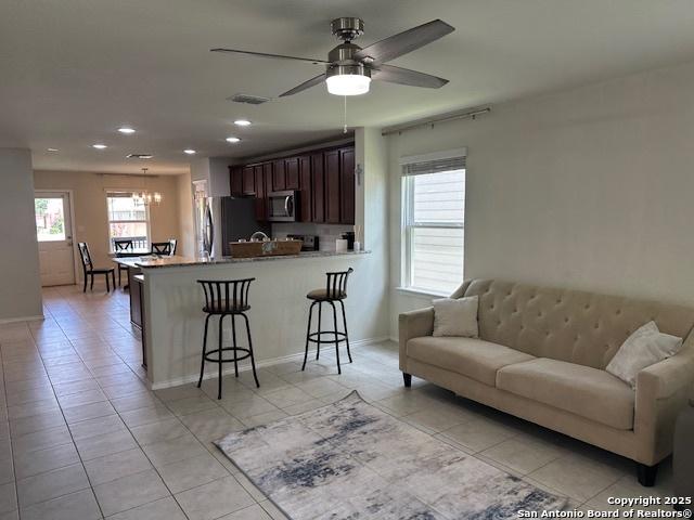 9510 Silveer Mist Way, San Antonio, TX 78254 - living area with light tile patterned flooring, recessed lighting, and a ceiling fan