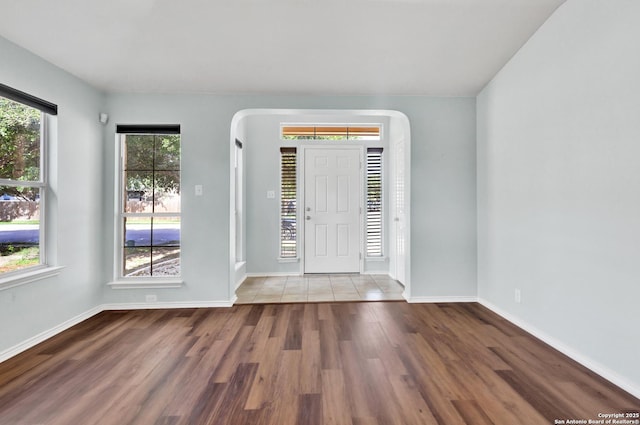 603 Starling Crk, New Braunfels, TX 78130 - foyer entrance with plenty of natural light, wood finished floors, and arched walkways
