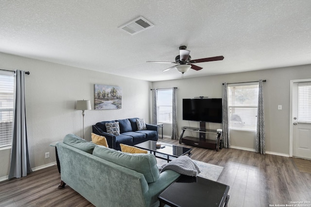 1826 Strawhouse, San Antonio, TX 78245 - living area featuring wood finished floors, ceiling fan, plenty of natural light, and a textured ceiling