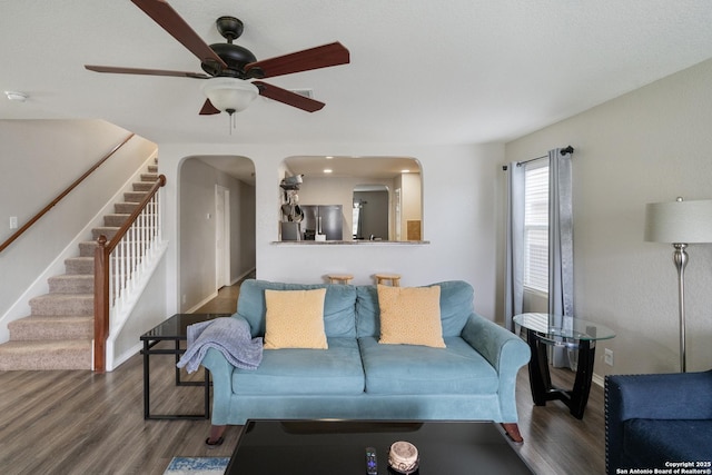 1826 Strawhouse, San Antonio, TX 78245 - living area featuring a ceiling fan, wood finished floors, stairs, and arched walkways