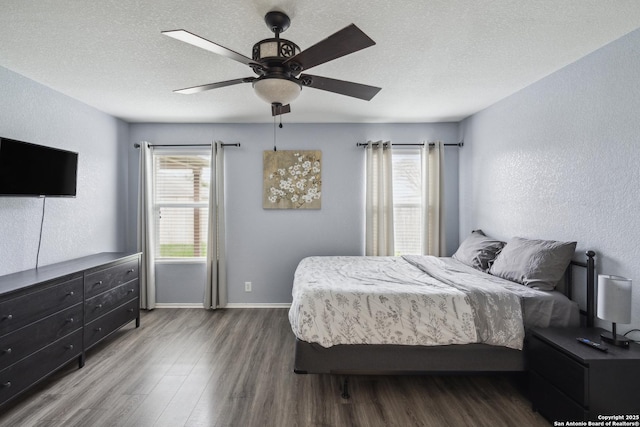 1826 Strawhouse, San Antonio, TX 78245 - bedroom featuring wood finished floors, a textured ceiling, ceiling fan, and a textured wall