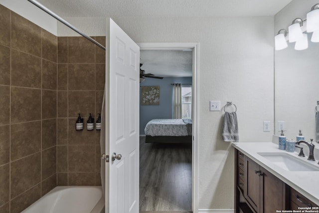 1826 Strawhouse, San Antonio, TX 78245 - ensuite bathroom with vanity, shower / bath combination, wood finished floors, and a ceiling fan