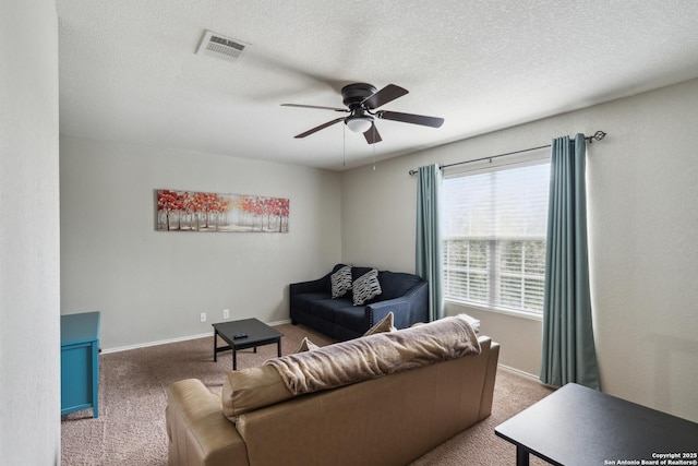1826 Strawhouse, San Antonio, TX 78245 - living area featuring ceiling fan, carpet floors, and a textured ceiling