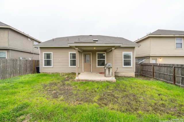 1826 Strawhouse, San Antonio, TX 78245 - rear view of house with a patio and a fenced backyard