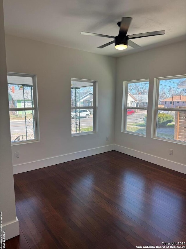 1306 Nolan, San Antonio, TX 78202 - spare room with dark wood-type flooring and ceiling fan