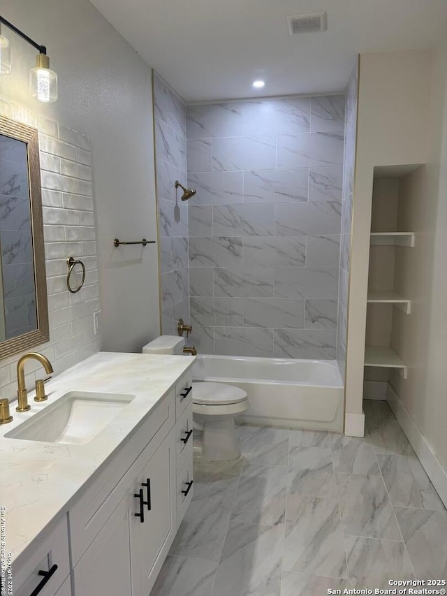 1306 Nolan, San Antonio, TX 78202 - full bath featuring vanity, marble look tiles, shower / bath combination, and recessed lighting