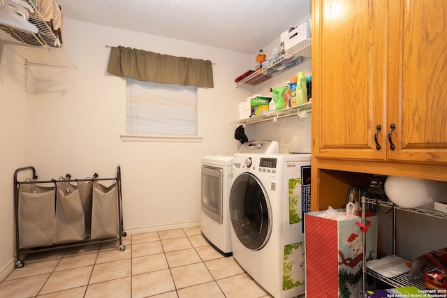 309 Meandering Way, Del Rio, TX 78840 - laundry room featuring cabinet space, washer and clothes dryer, light tile patterned flooring, and a textured ceiling