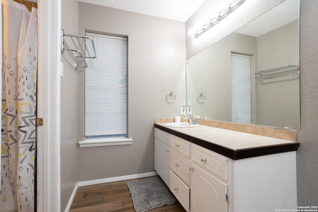 309 Meandering Way, Del Rio, TX 78840 - full bath with wood finished floors, vanity, and a shower with curtain