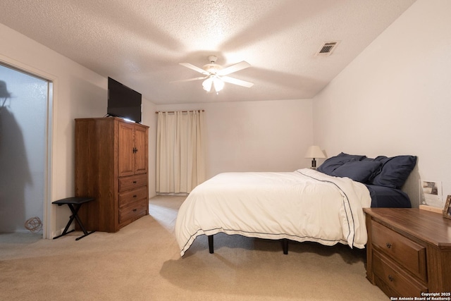 309 Meandering Way, Del Rio, TX 78840 - bedroom with a textured ceiling, light colored carpet, and ceiling fan